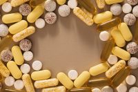 Kaboompics - Colorful Vitamin Pills Arranged on a Beige Background