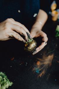 Kaboompics - Woman Painting Black & Gold Easter Eggs