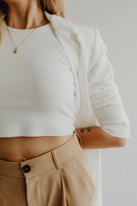 Kaboompics - Minimal Fashion Detail of White Shirt and Beige Trousers