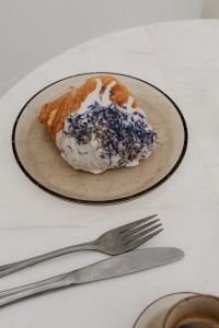 Kaboompics - Berry Cream Croissant with Espresso and Cutlery