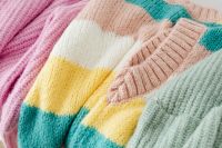 Kaboompics - Pastel Sweater Stack on a White Background