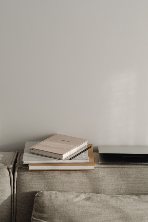 Soft Neutral Home Office Background with Closed Laptop and Planner on ...