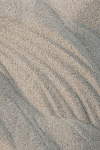 Kaboompics - Soft Gray Sand Texture with Subtle Curved Ripples