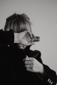 Kaboompics - Black and White Woman's Hand Across Face with Necklace
