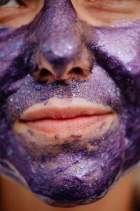 Kaboompics - Extreme Close-Up of Purple Glitter Face Mask Around a Woman’s Nose and Lips
