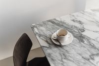Kaboompics - White Coffee Cup and Saucer on Arabescato Marble
