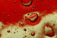 Kaboompics - Red Water Droplets on Glass Macro Abstract Background