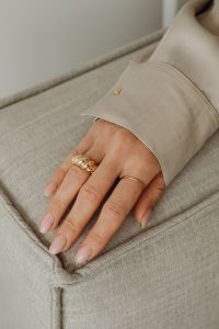 Kaboompics - Woman's Hand with Gold Rings and Pearl Jewelry