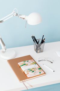 Kaboompics - Pencil Cup and Desk Lamp Beside a Colorful Planner