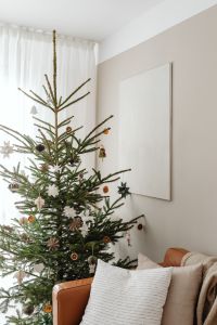 Kaboompics - Christmas Tree beside Leather Armchair and Neutral Wall