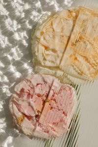 Kaboompics - Cream and Blush Flowers Behind Rippling Glass with Reflective Highlights, Botanical Background