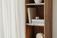 Kaboompics - Wide Living Room Bookshelf Styling with Neutral Books and Soft Curtains