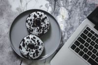 Kaboompics - Cookies And Cream Donuts Beside Laptop On Marble