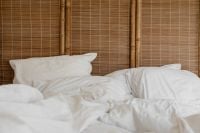 Kaboompics - White Bed with Bamboo Headboard