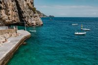 Kaboompics - Swimmers and Boats at a Rocky Amalfi Coast Bathing Platform