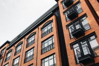 Kaboompics - Oblique View of Brick Apartment Facade and Black Balconies
