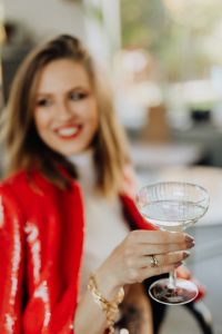 Kaboompics - New Year's Eve Champagne Toast in Red Suit, Soft Focus