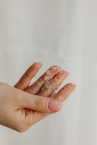 Kaboompics - Close-Up of Sea Salt Body Scrub on Fingertips Before Exfoliation