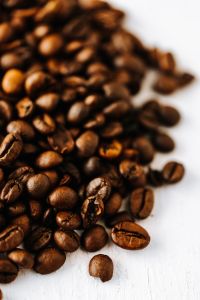 Kaboompics - Softly Blurred Coffee Beans Against White for Minimal Coffee Shop Marketing