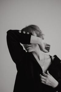 Kaboompics - Monochrome Woman Covering Face with Ringed Hand