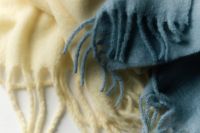 Kaboompics - Close Up of Blue and Cream Fringed Scarves for Cozy Lifestyle