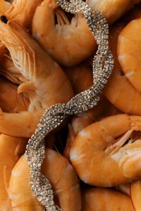 Kaboompics - Creative Food Product Styling with Cooked Shrimp and Rhinestone Bracelet, Seafood and Jewelry Photography
