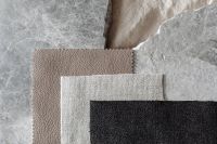 Kaboompics - Layered Beige, White, and Black Textile Swatches on Stone