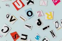Kaboompics - Mixed Alphabet Cutouts on a Pastel Blue Background