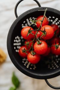 Kaboompics - Top View of Cherry Tomatoes Inside a Black Colander