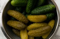 Kaboompics - Fresh Cucumbers and Pickles in a Metal Colander, Overhead Food Close-Up