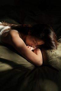 Kaboompics - Woman Resting in Bed in a Quiet Bedroom