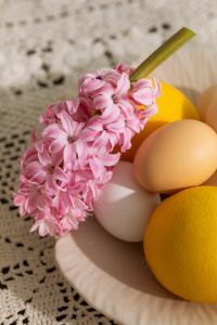 Kaboompics - Pastel Eggs, Lemon and Goblet on Crochet Easter Tablecloth
