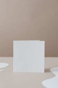 Kaboompics - Overlapping Blank White Cards on Minimal Beige Surface with Copy Space