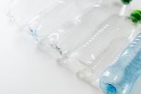 Kaboompics - Close-Up of Plastic Bottles with Blue and Green Caps