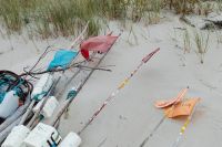 Kaboompics - Small Fishing Boats and Oars on a Sandy Baltic Beach