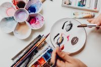 Kaboompics - A woman paints with watercolors