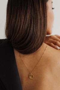 Kaboompics - Black Camisole with Gold Pendant Necklace and Hoop Earring