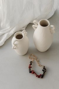 Kaboompics - Red and Black Beaded Necklace with Ceramic Vases