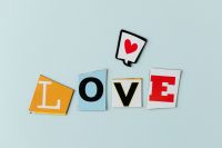 Kaboompics - Colorful Cutout LOVE Letters with Red Heart Sticker, Bright Typography for Valentine Graphics