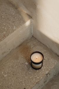 Kaboompics - Single Scented Candle on a Concrete Step