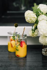 Kaboompics - Close-Up Peach and Orange Drink with Fresh Mint, Summer Beverage Photography for Café Menus