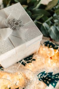 Kaboompics - Close-Up White Gift Box with Snowflake Detail and Eucalyptus