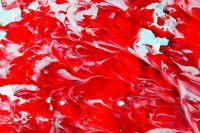 Kaboompics - Bold Red Acrylic Paint with Pale Blue and White Accents for Graphic Backgrounds