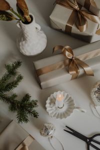 Kaboompics - Overhead Christmas Gift-Wrapping Flat Lay with Neutral Boxes, Satin Bows and Pine