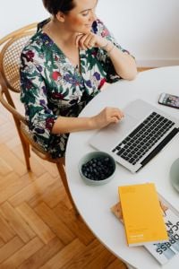 Kaboompics - Woman Thinking at a Laptop While Working from Home