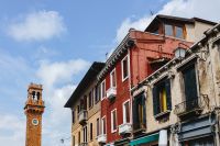 Kaboompics - Murano Clock Tower and Historic Colorful Buildings along a Venice Island Street