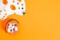 Kaboompics - Halloween Eyeball Candy Bucket on Orange Background