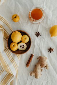 Kaboompics - Quince and Spices Flat Lay with Lemon, Honey, Cinnamon and Star Anise, Vertical Food Photo