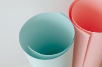 Kaboompics - Overhead View of Teal and Coral Paper Roll Openings