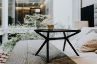 Kaboompics - Black Tray Table on Modern Bed with Textured Bedding